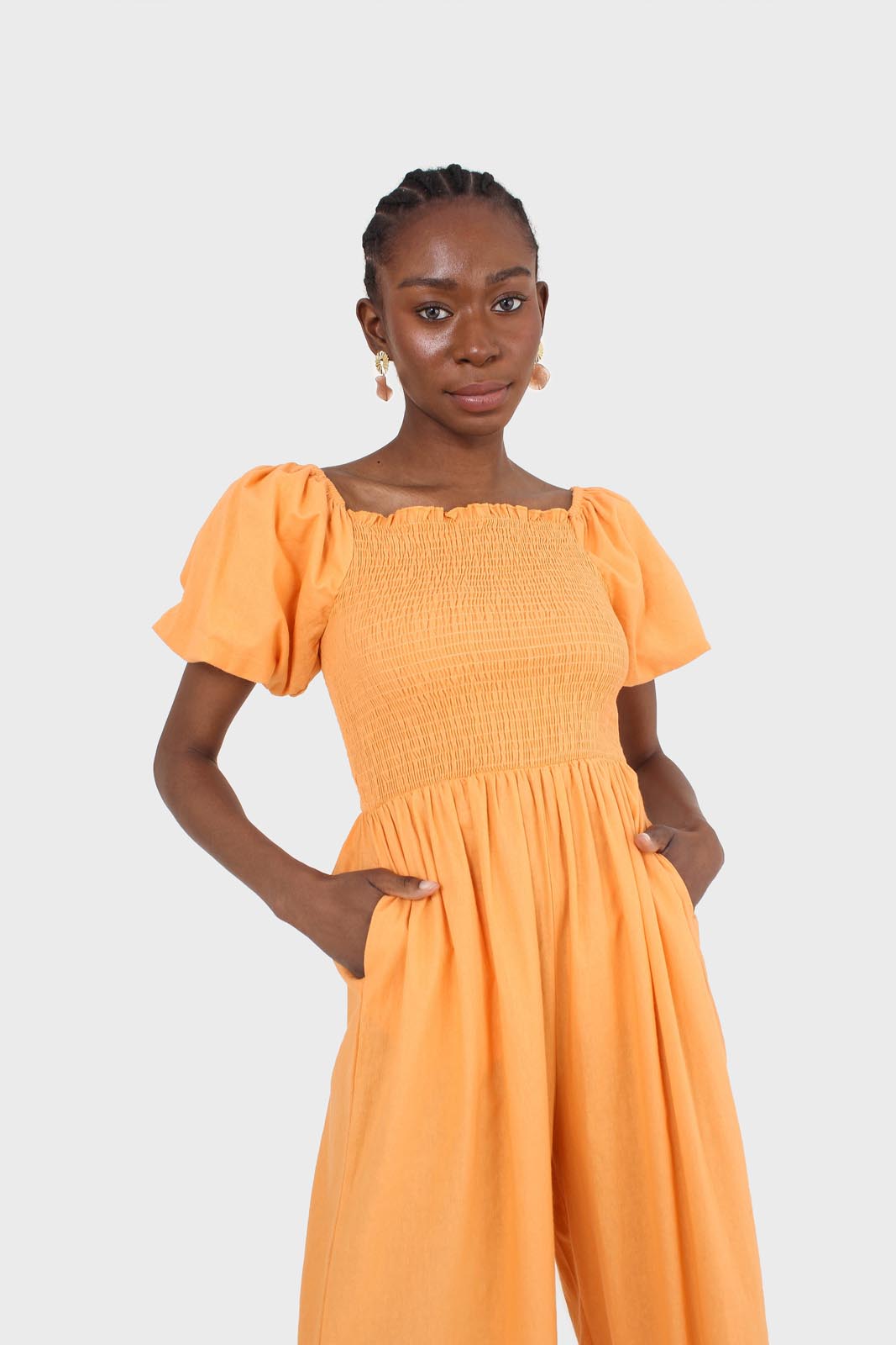 Orange short sleeved ruched bodice jumpsuit