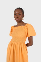 Orange short sleeved ruched bodice jumpsuit