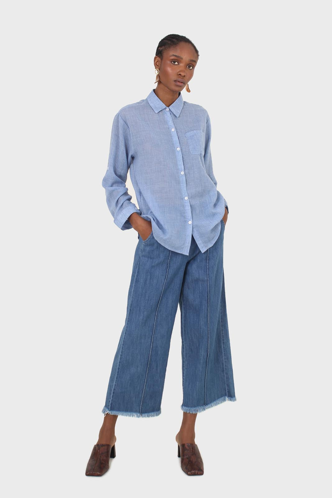 Blue pin tuck raw hem jeans