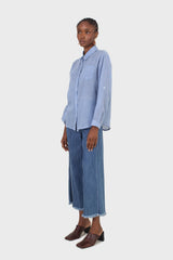 Blue pin tuck raw hem jeans