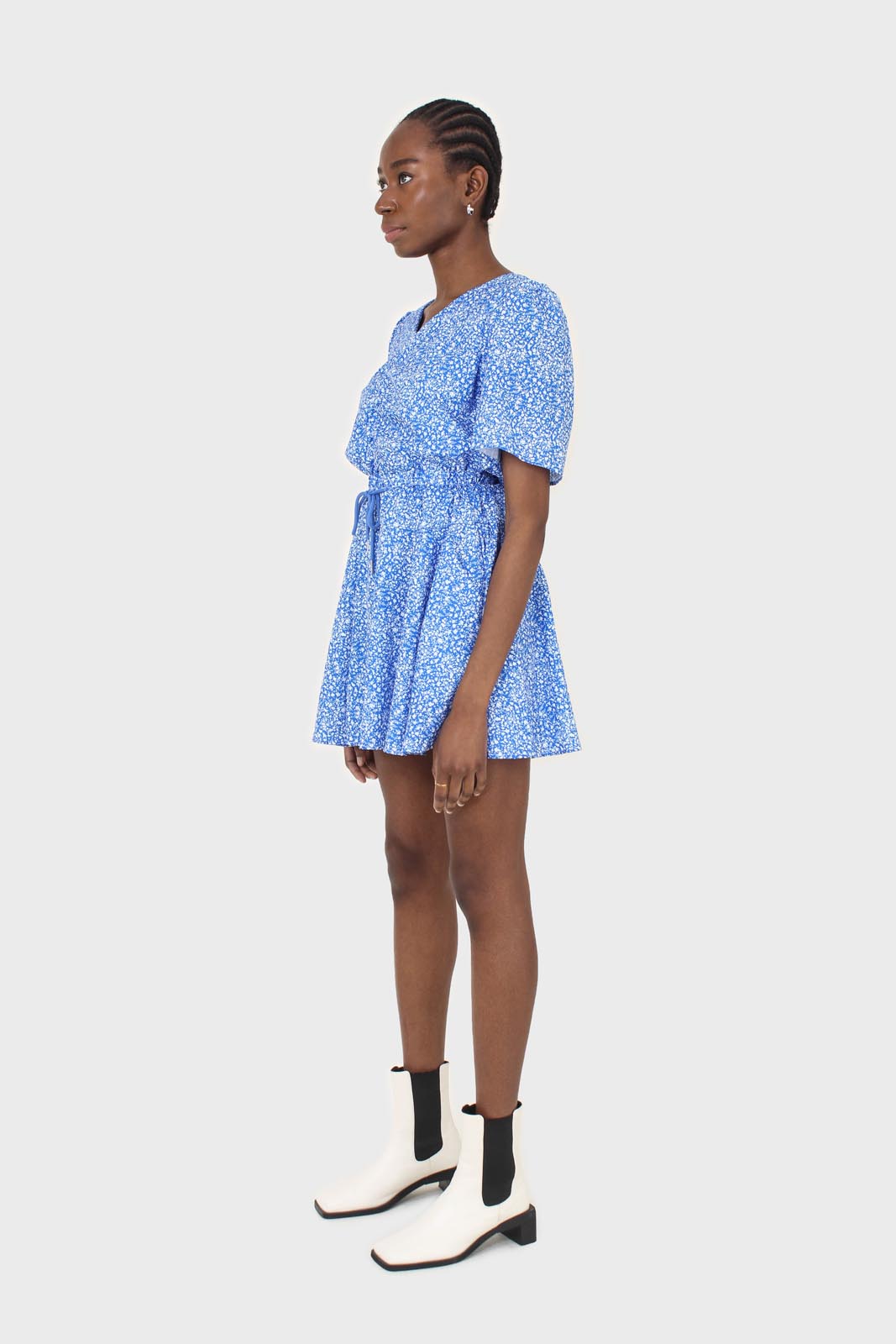 Blue and white floral print tie waist romper