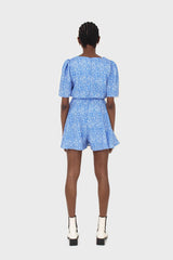 Blue and white floral print tie waist romper