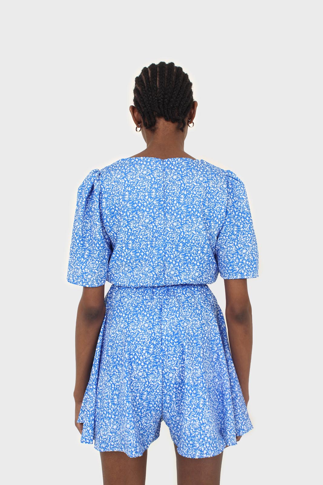 Blue and white floral print tie waist romper