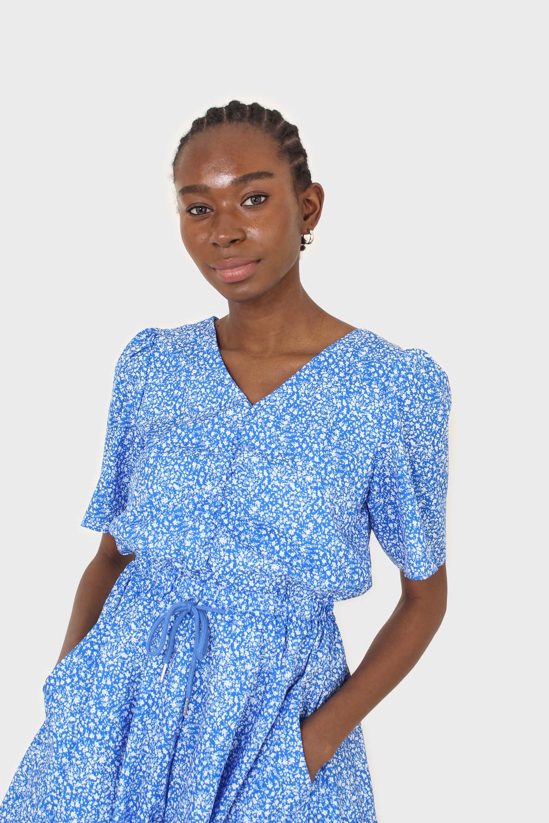 Blue and white floral print tie waist romper