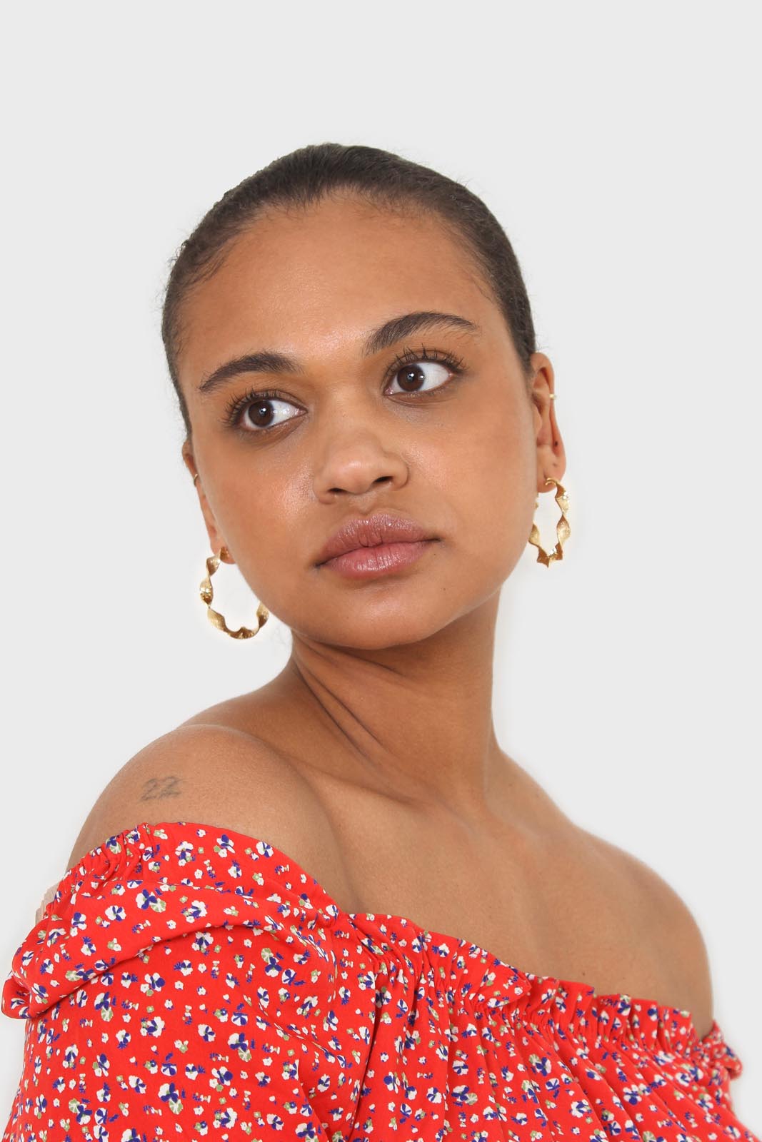 Red floral print off shoulder short sleeved top