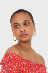 Red floral print off shoulder short sleeved top