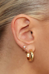 Gold dangling pearl single huggie earring - 4mm