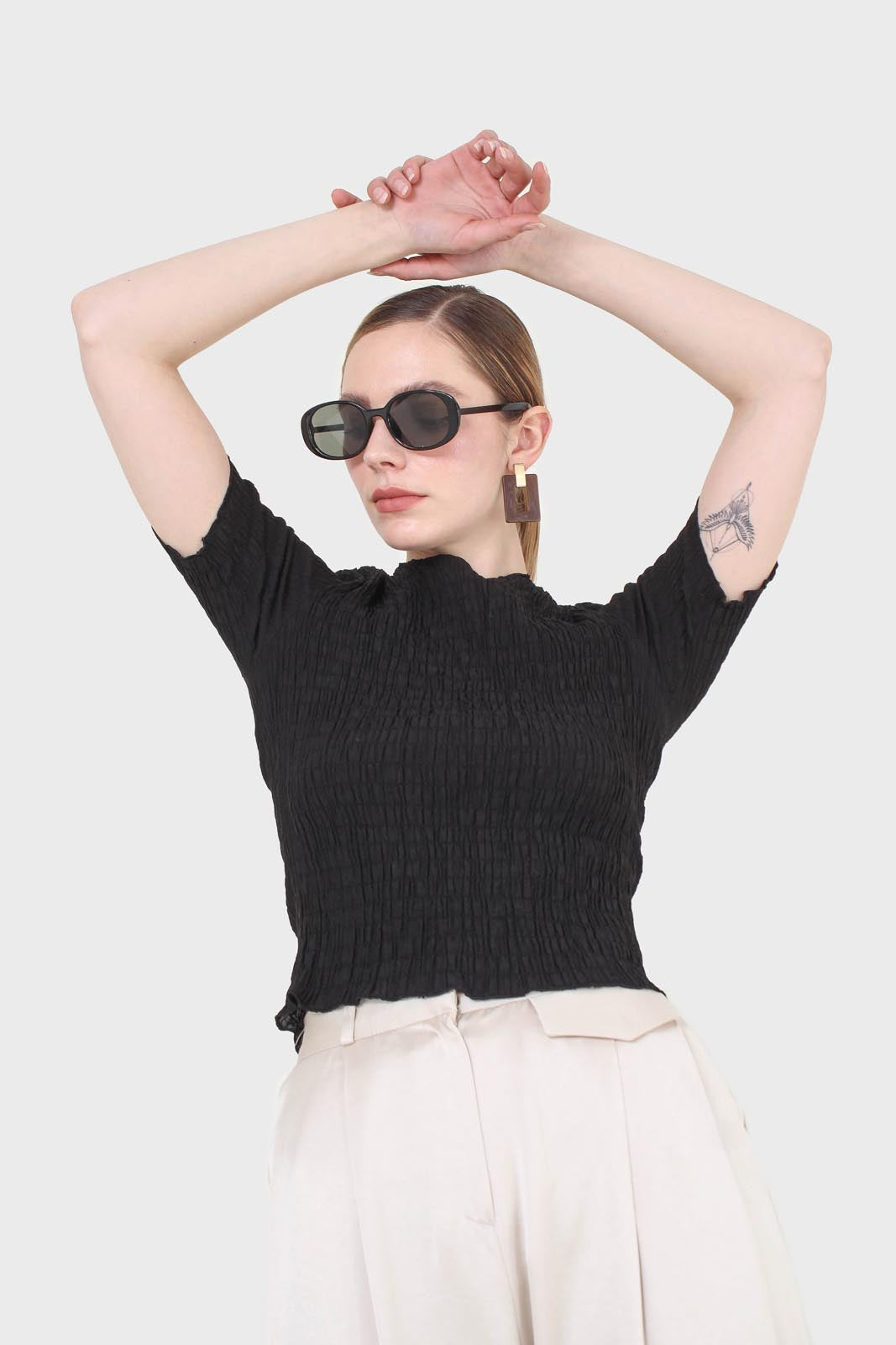 Black smocked fitted short sleeved top
