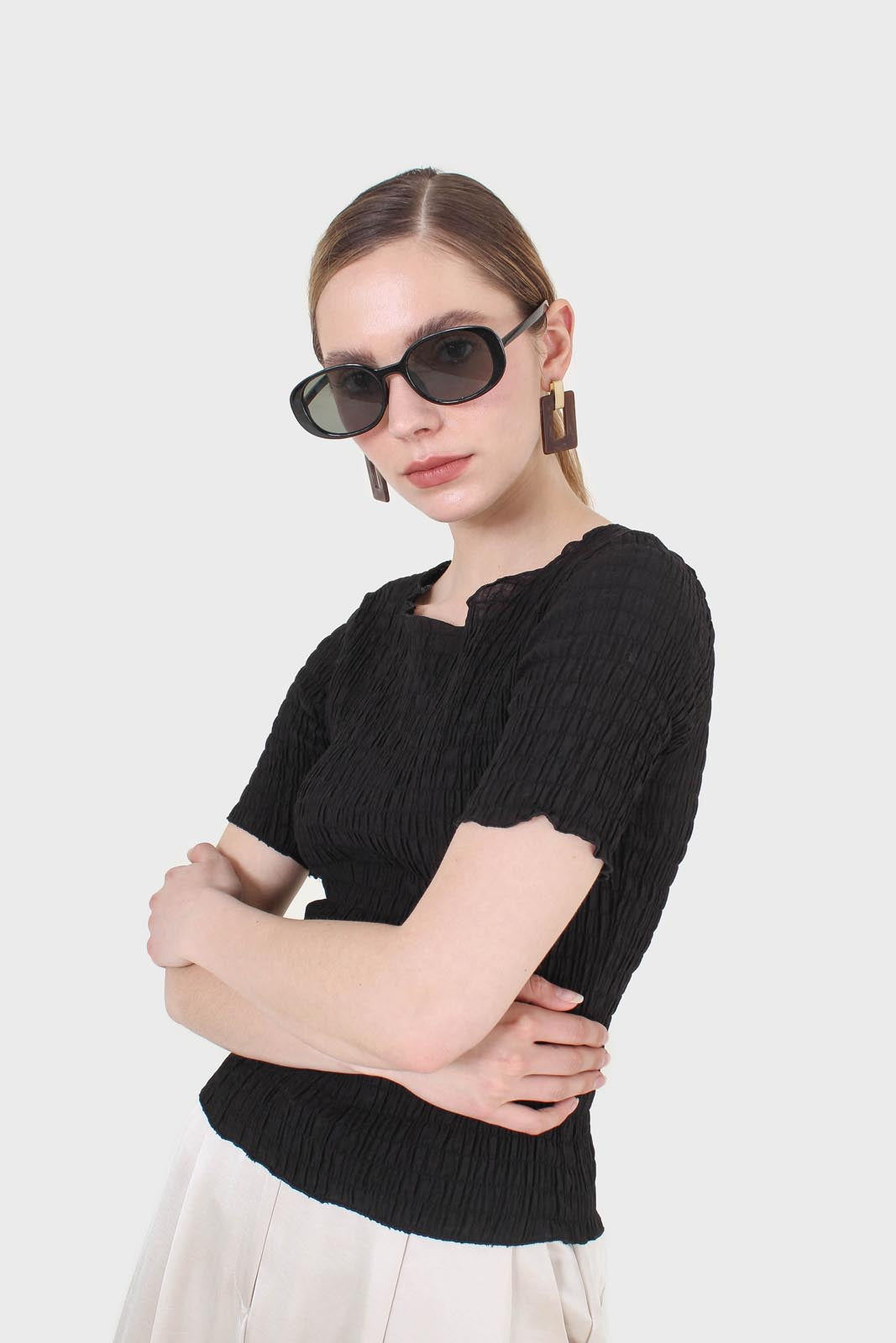 Black smocked fitted short sleeved top