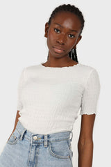 White smocked fitted short sleeved top