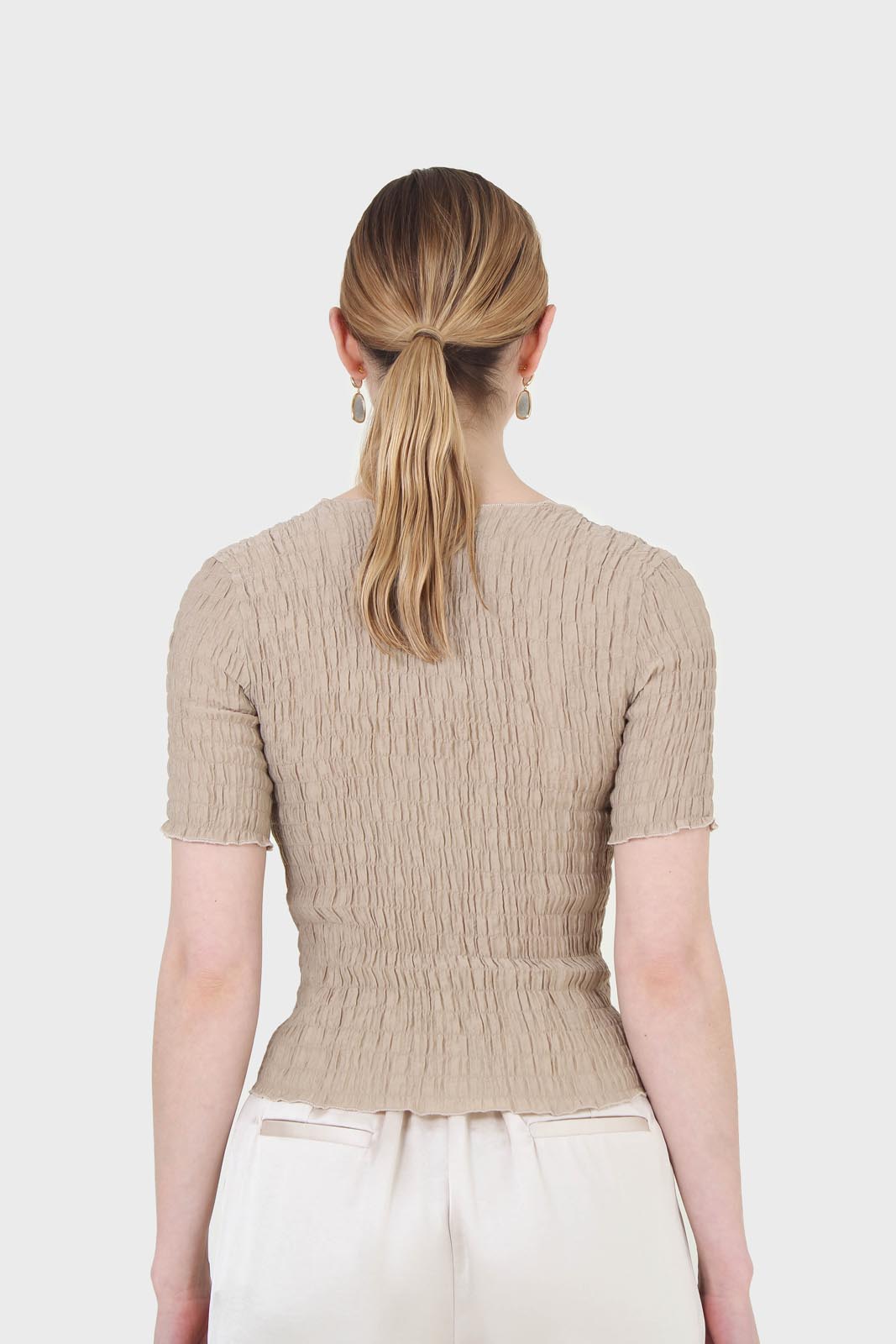 Beige smocked fitted short sleeved top