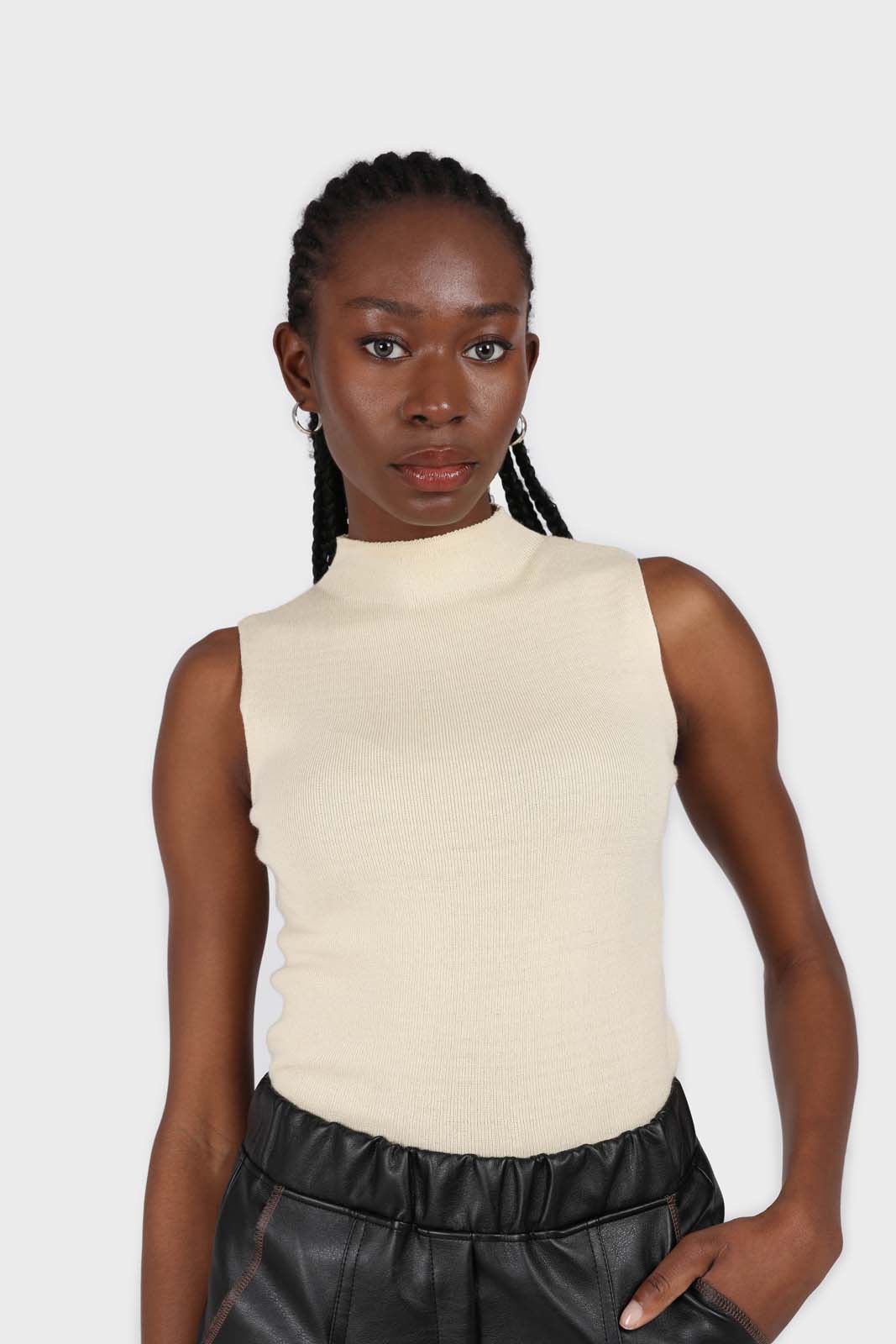 Light beige sleeveless mock neck knit tank