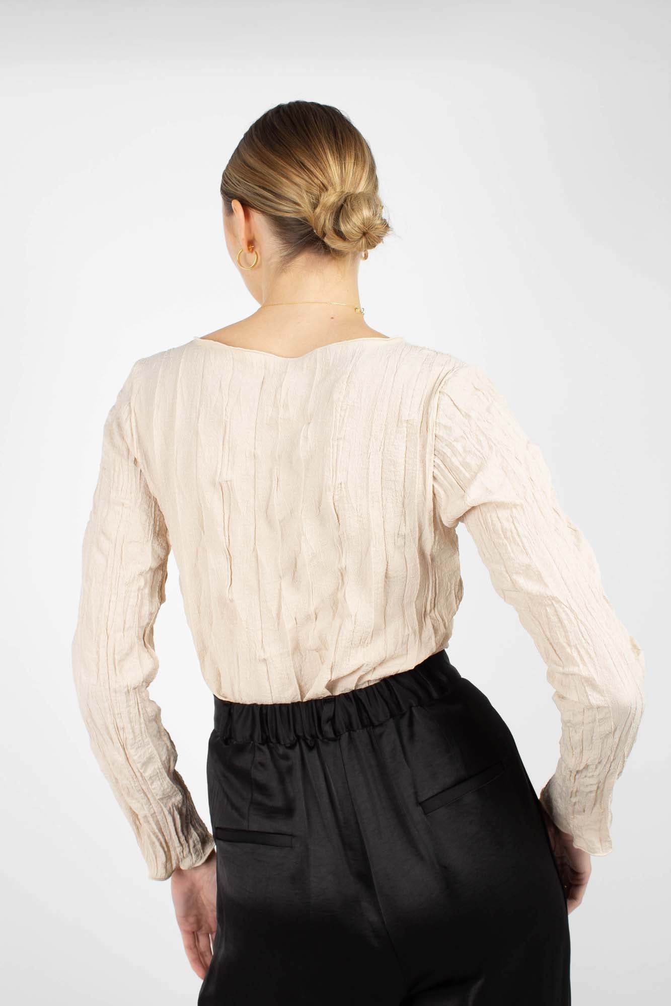 Beige wrinkled long sleeved top