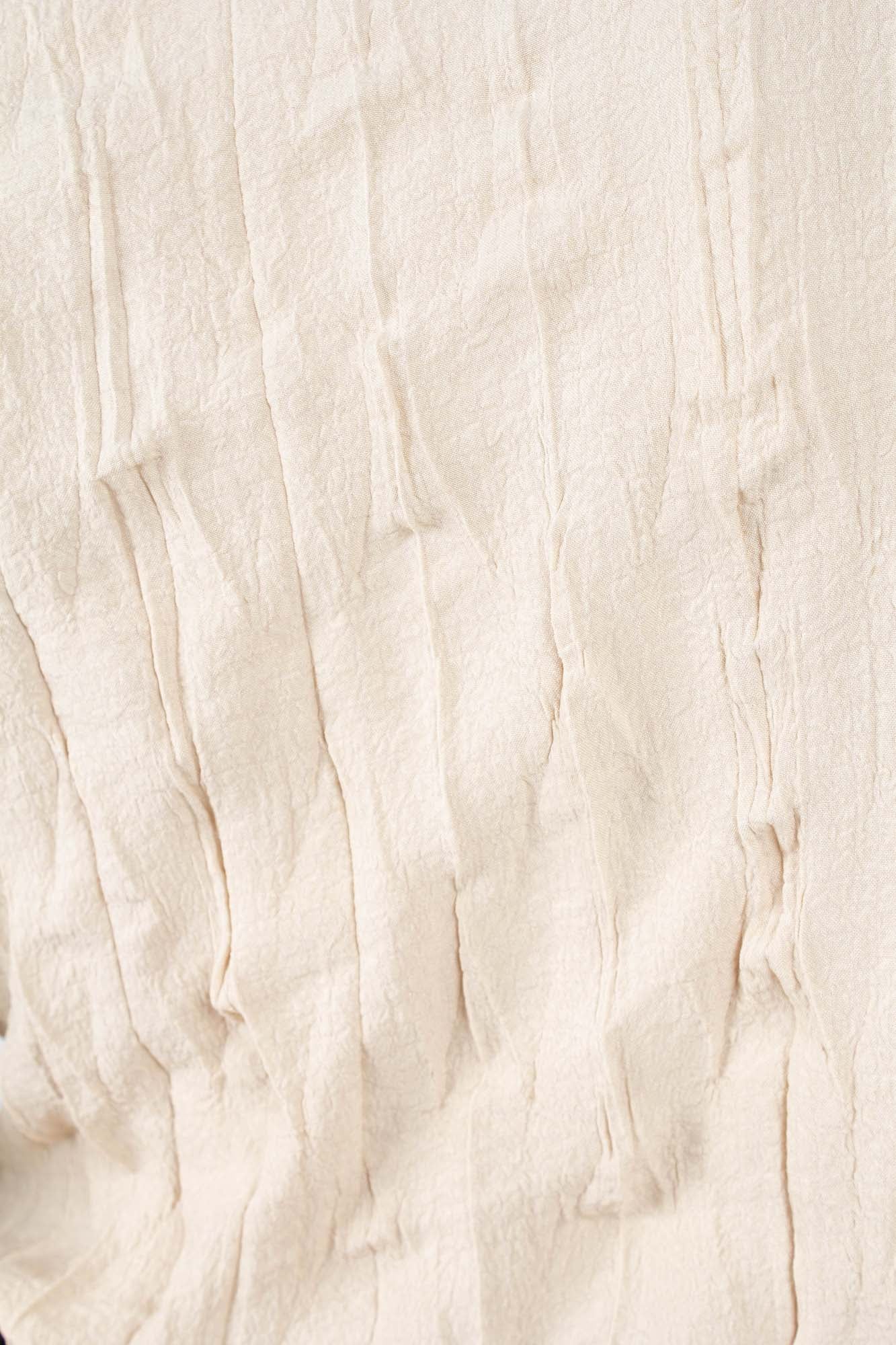 Beige wrinkled long sleeved top