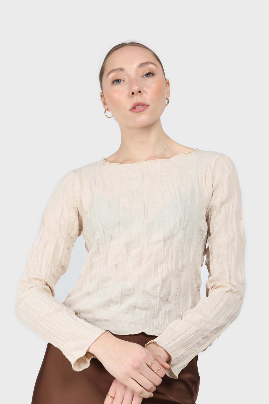 Beige wrinkled long sleeved top