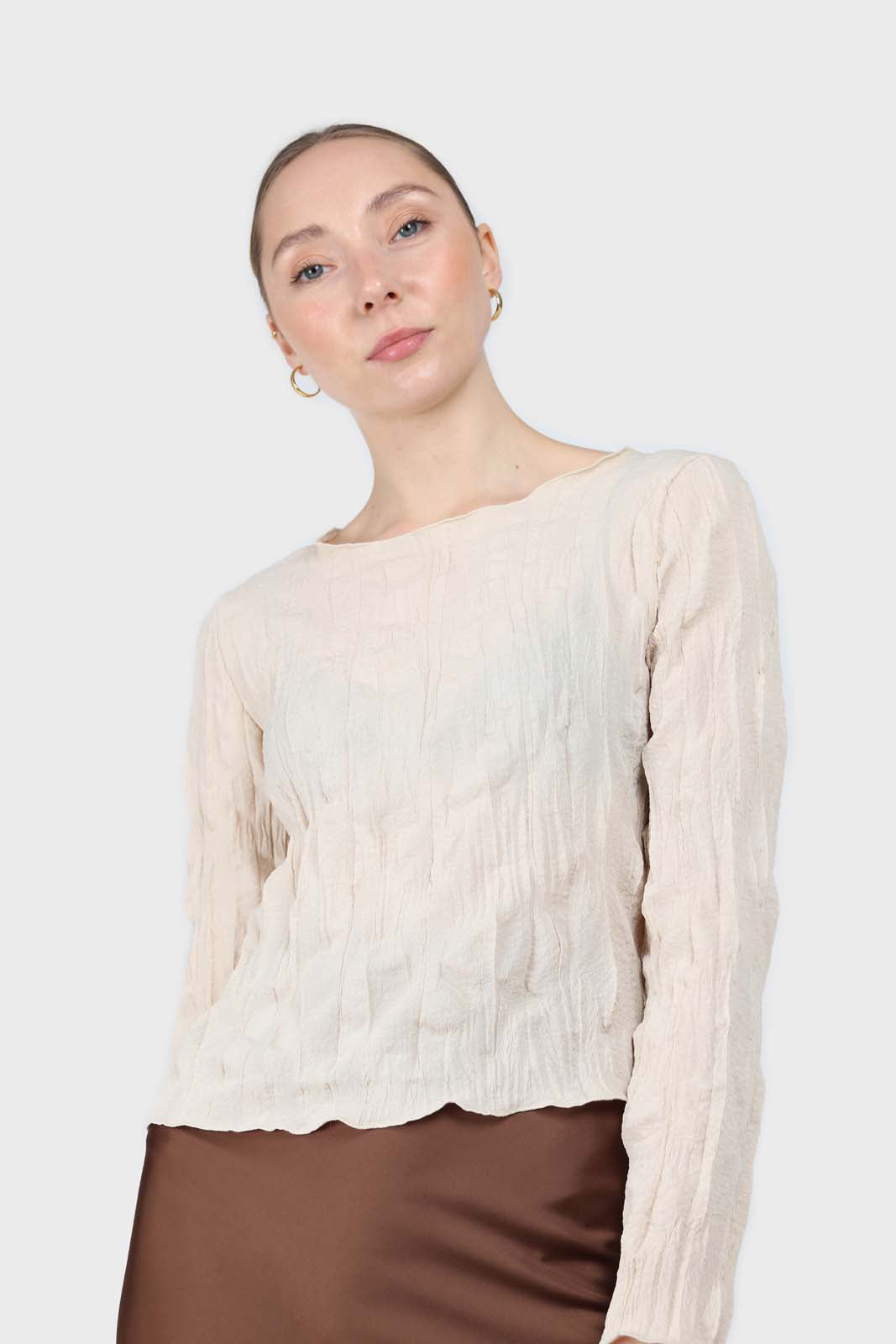 Beige wrinkled long sleeved top