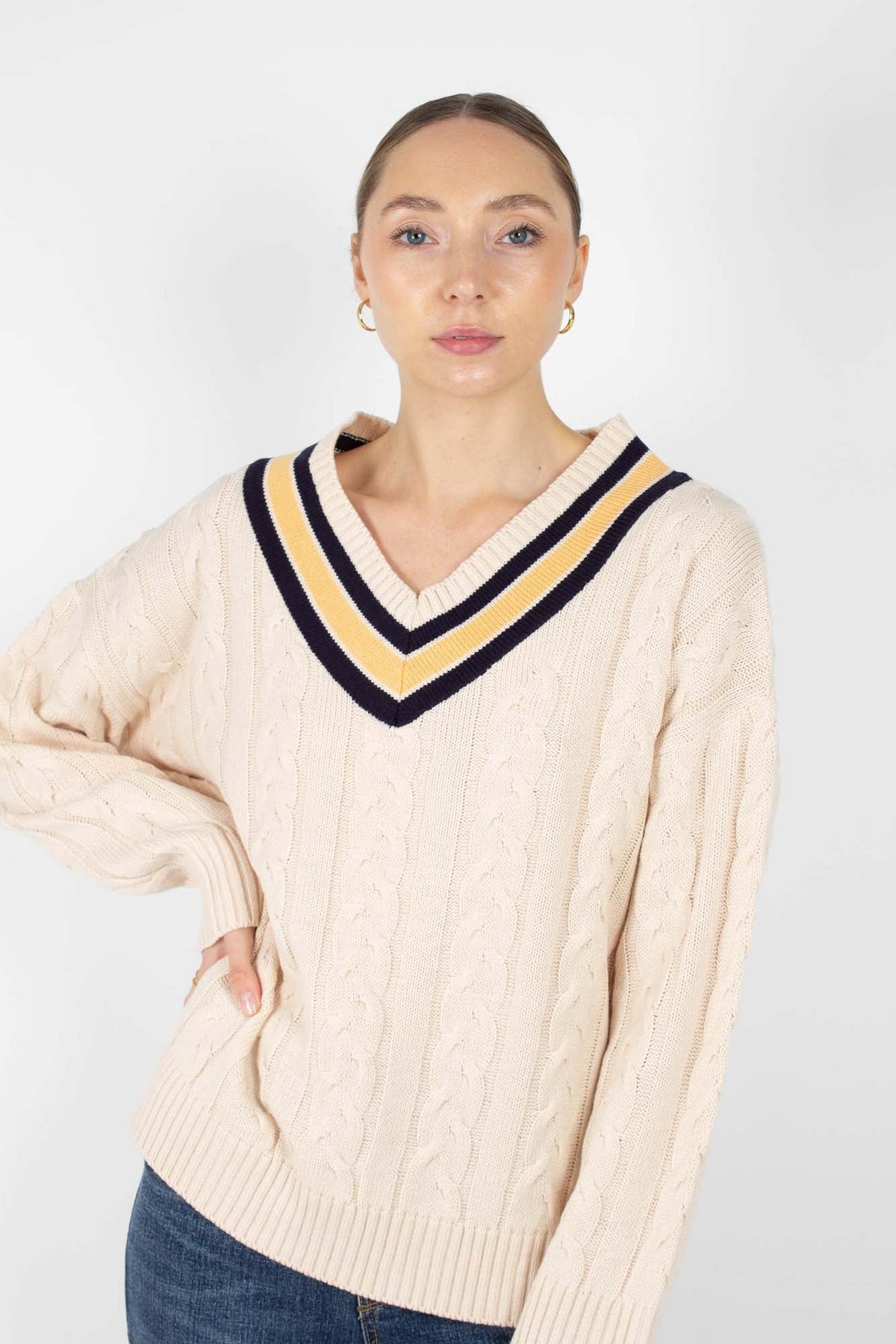 Cream and yellow V-neck cableknit jumper