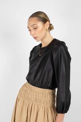 Black glossy faux leather top