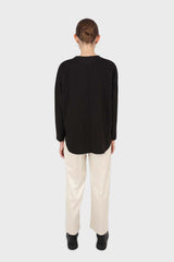 Black vegan leather contrast hem top