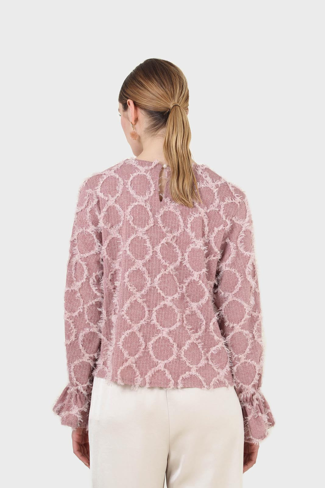 Pale pink cross tuft pattern blouse
