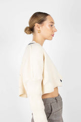 Ivory and black deep V cross front knit top