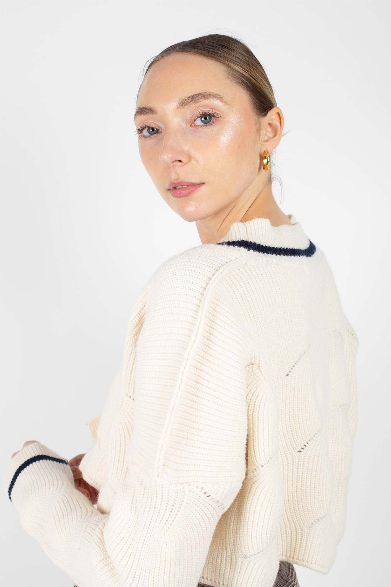 Ivory and black deep V cross front knit top