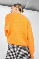 Bright orange crew neck loose fit jumper