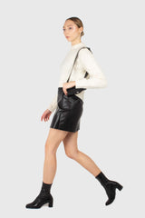 Black vegan leather cross front mini skirt