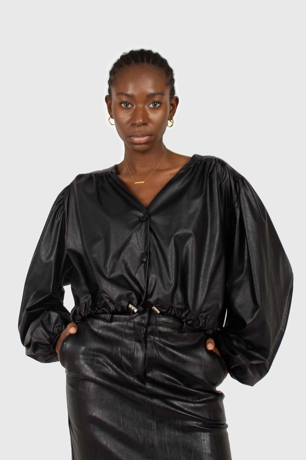 Black vegan leather v-neck puff sleeved blouse
