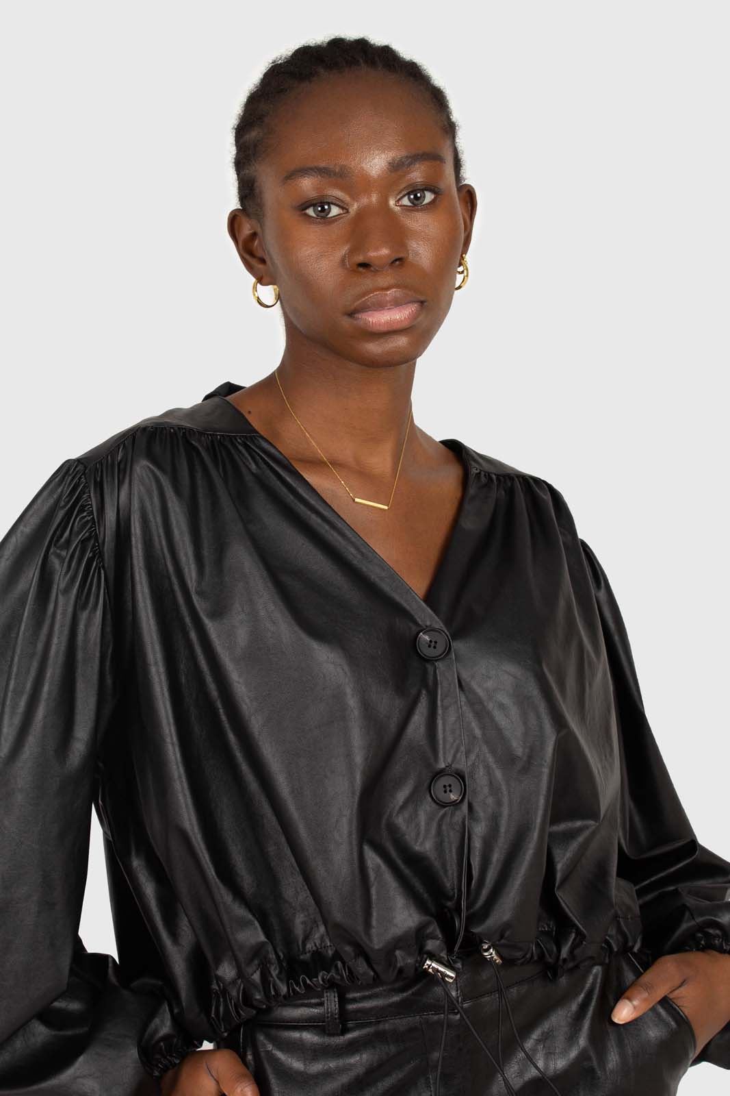Black vegan leather v-neck puff sleeved blouse