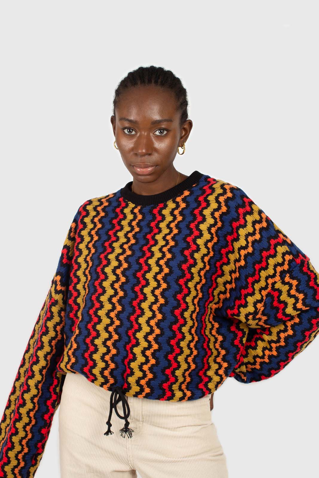Bold red orange and blue zig-zag jumper