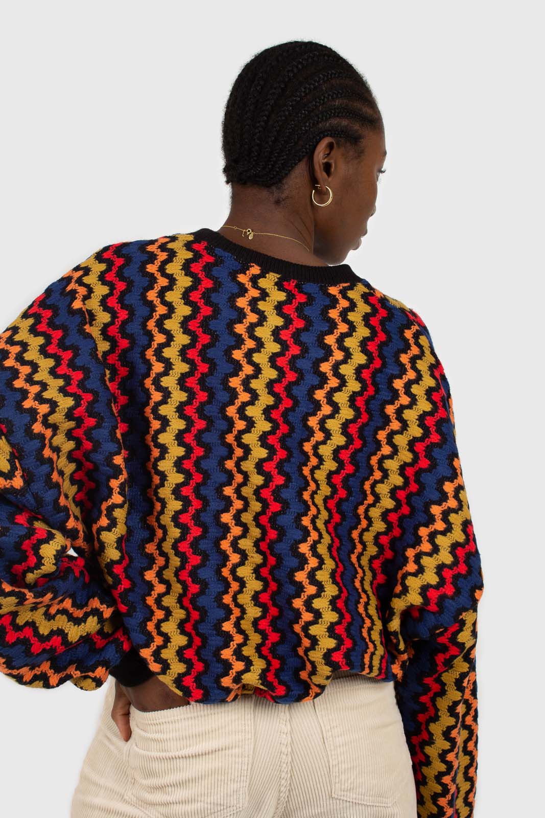 Bold red orange and blue zig-zag jumper
