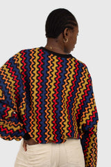 Bold red orange and blue zig-zag jumper