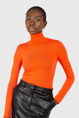 Bright orange soft jersey turtleneck top