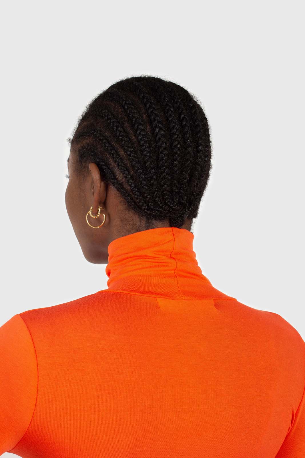 Bright orange soft jersey turtleneck top