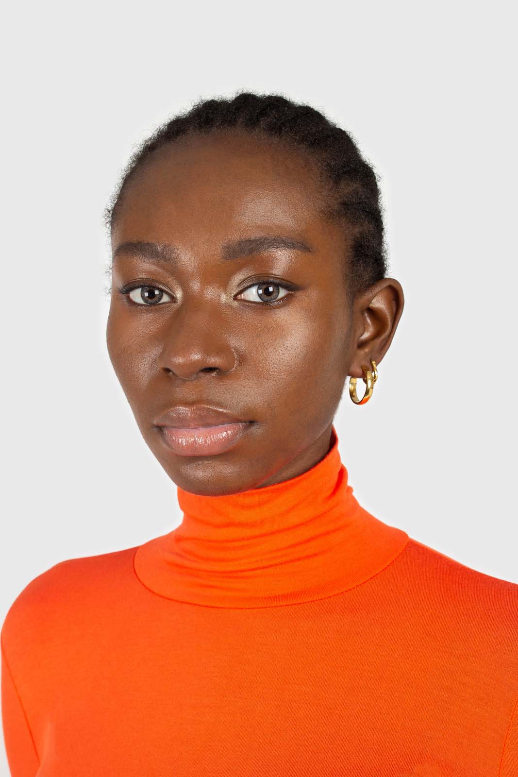 Bright orange soft jersey turtleneck top