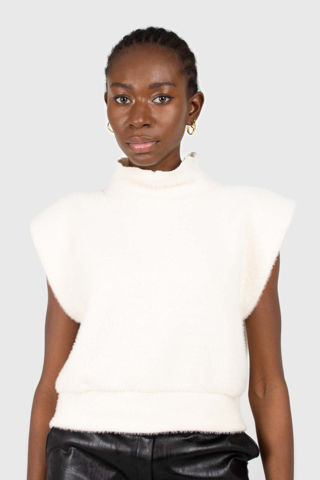 Ivory fuzzy structured shoulder pad vest top
