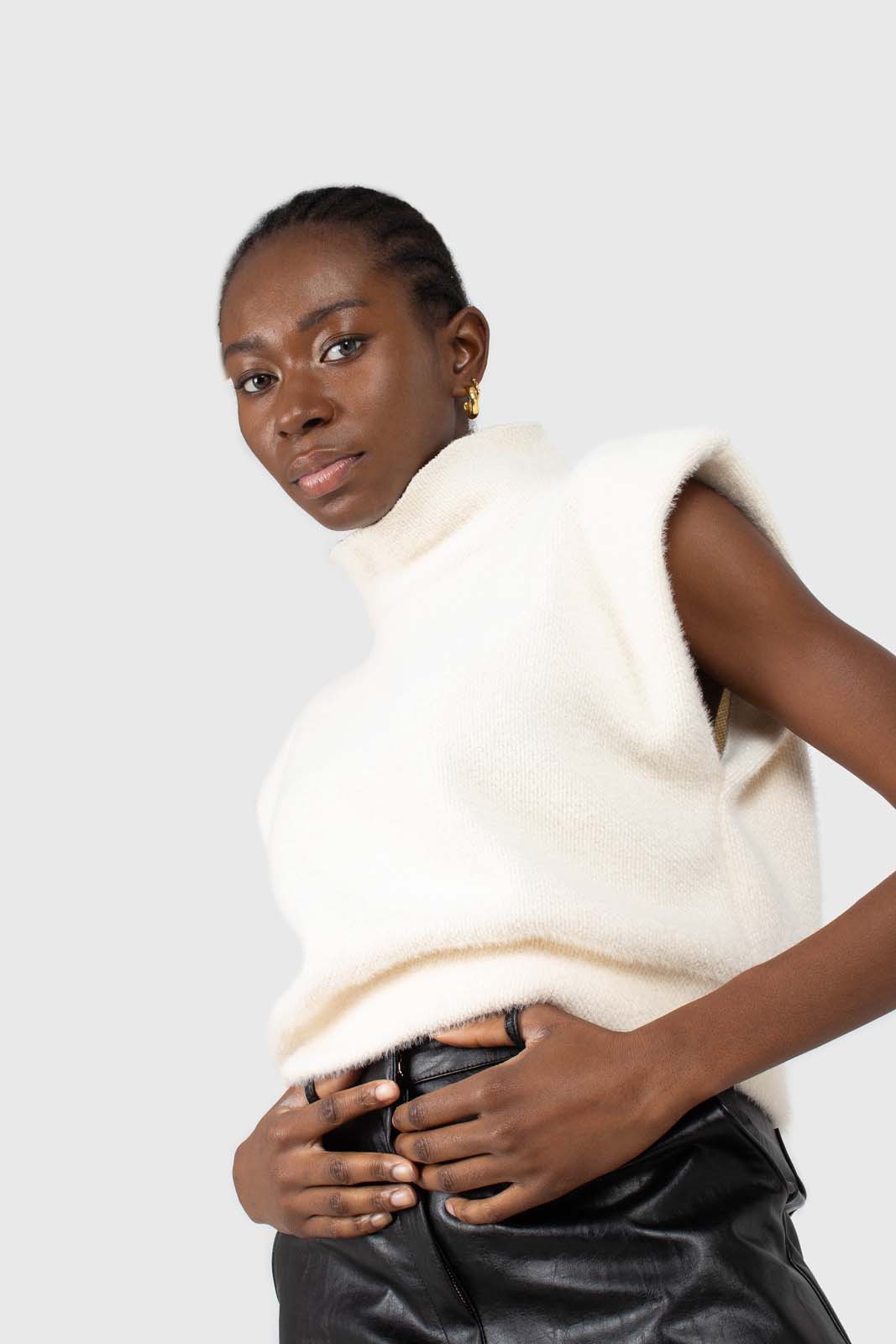 Ivory fuzzy structured shoulder pad vest top