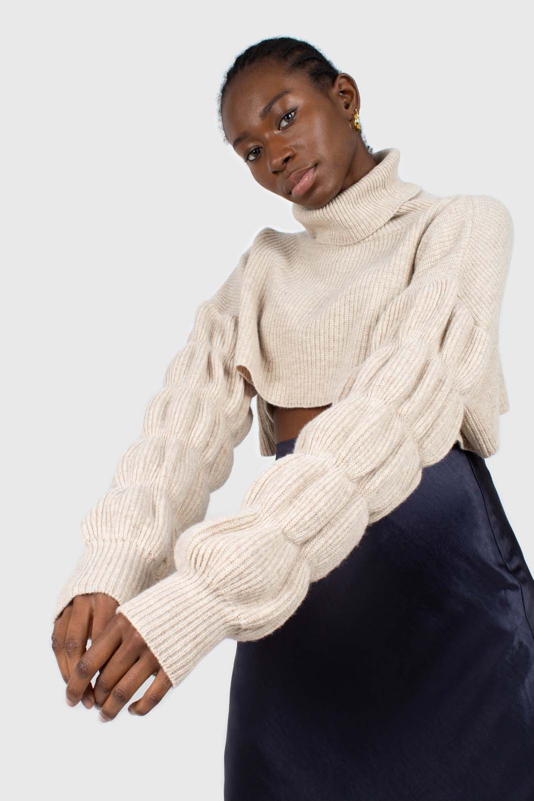 Beige balloon sleeved cropped wool blend turtleneck top