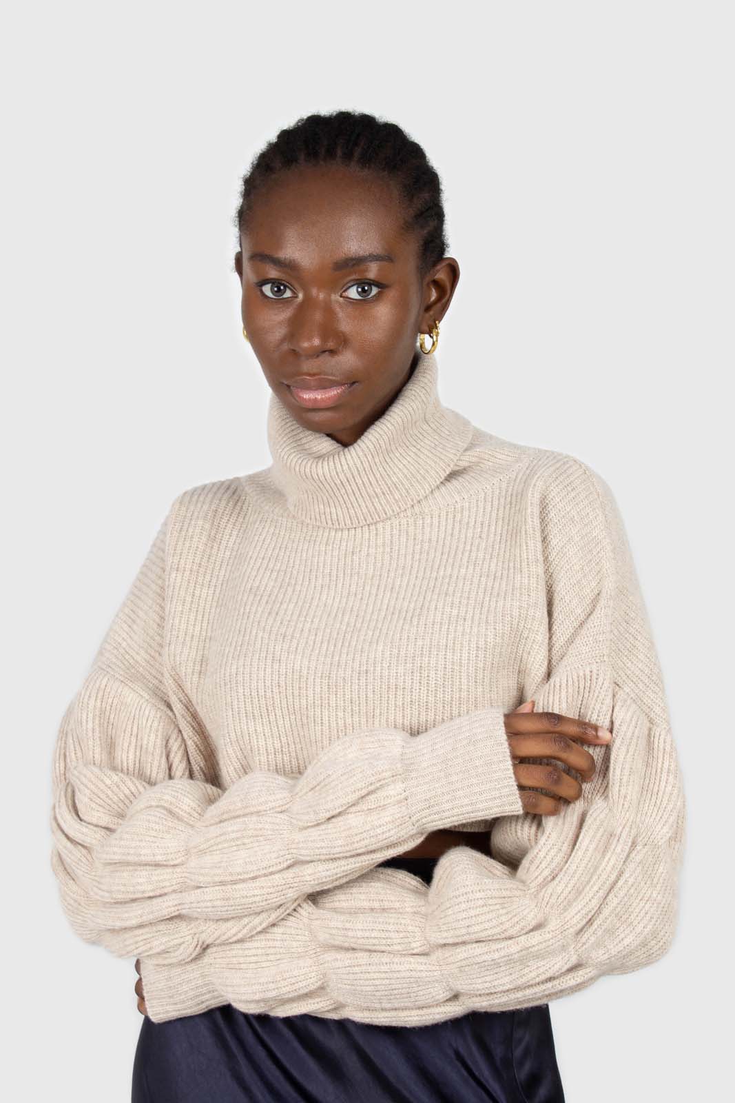 Beige balloon sleeved cropped wool blend turtleneck top