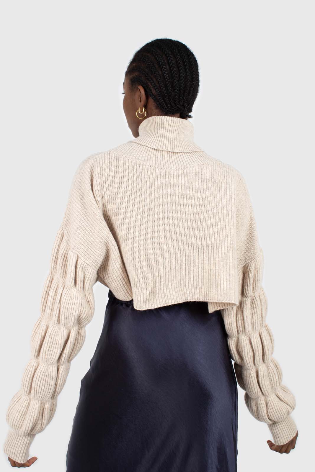 Beige balloon sleeved cropped wool blend turtleneck top