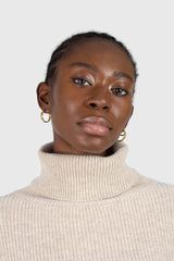 Beige balloon sleeved cropped wool blend turtleneck top