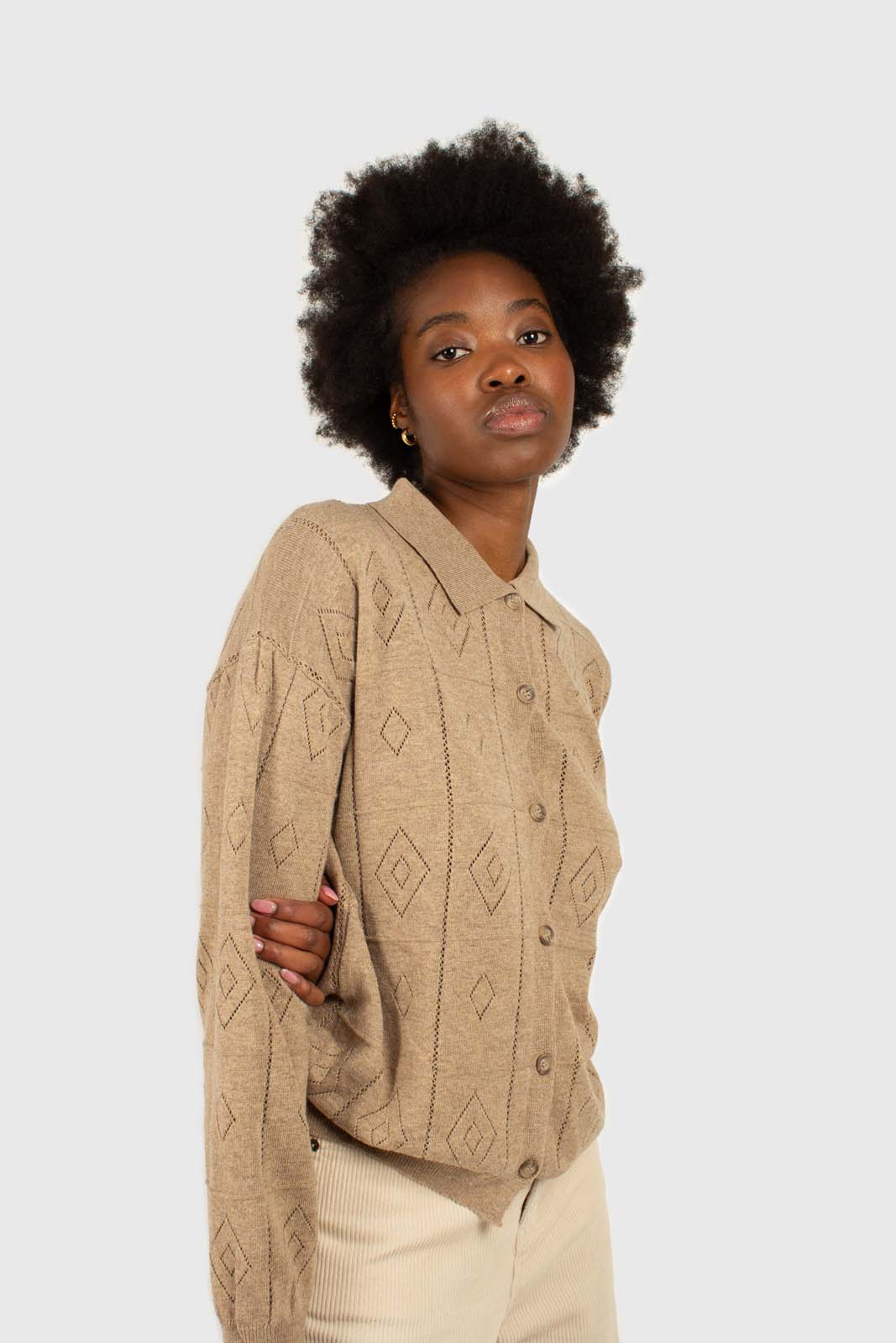 Beige patterned wool-blend knit polo top