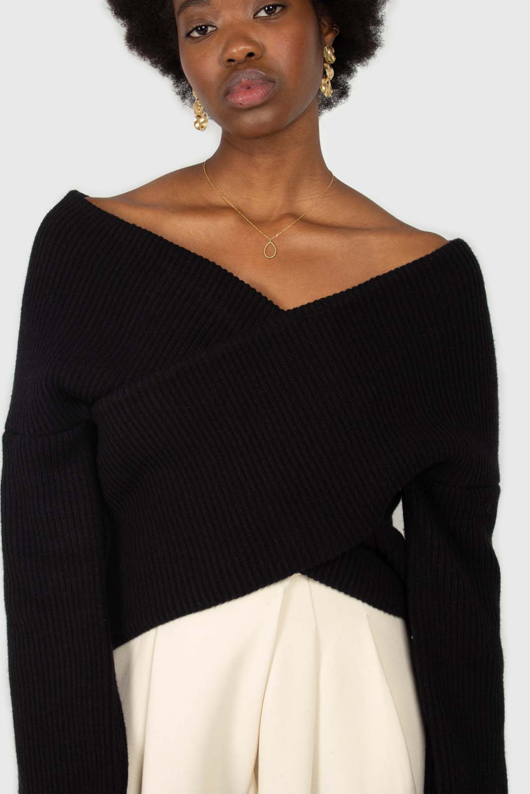Black cross front panel knit top