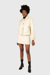 Ivory vegan leather mini skirt