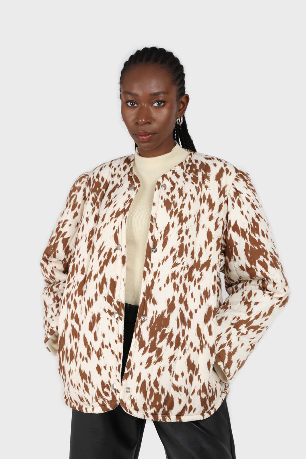 Ivory and brown animal print quilted puffer coat
