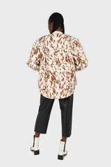 Ivory and brown animal print quilted puffer coat
