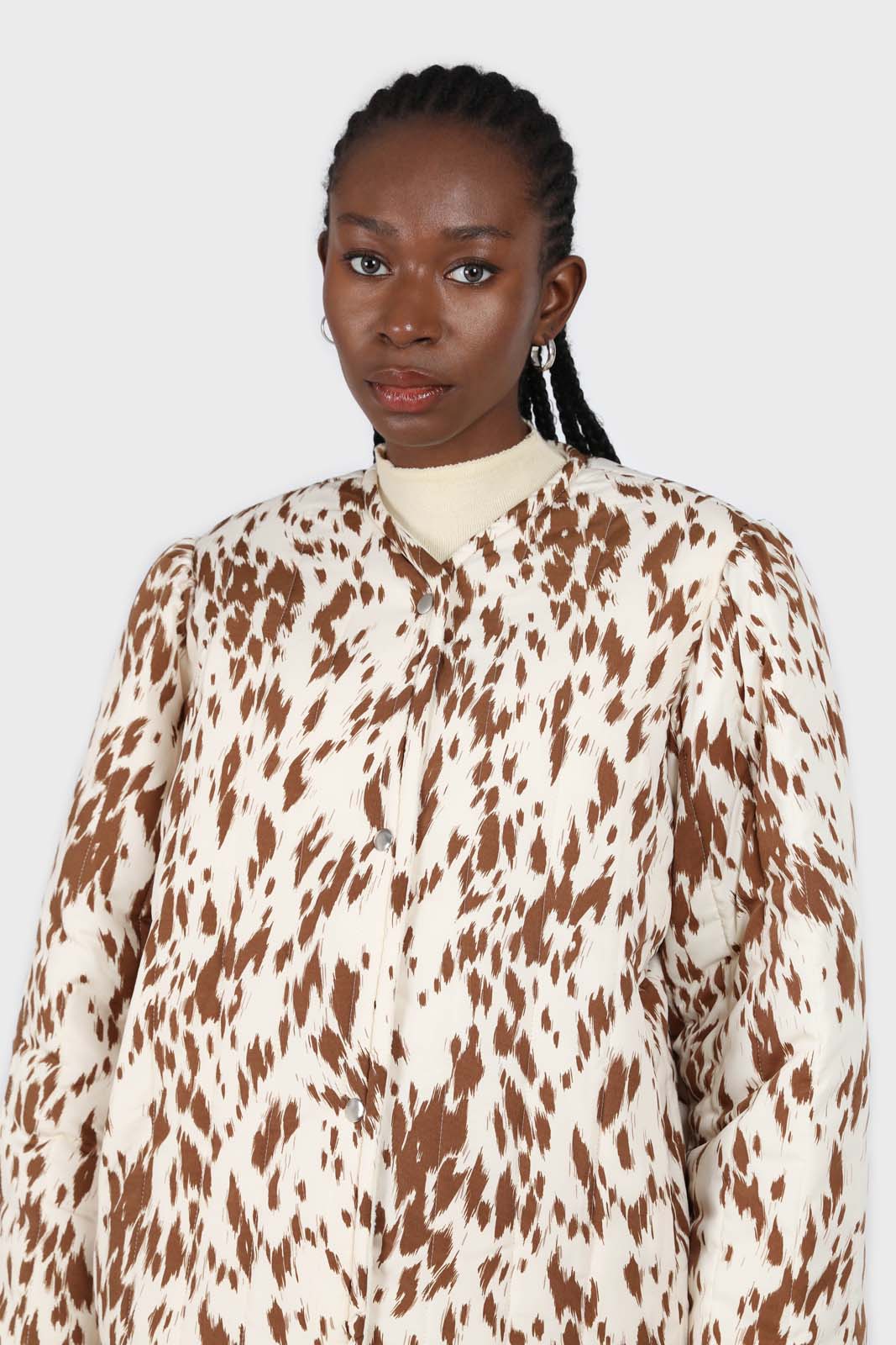 Ivory and brown animal print quilted puffer coat