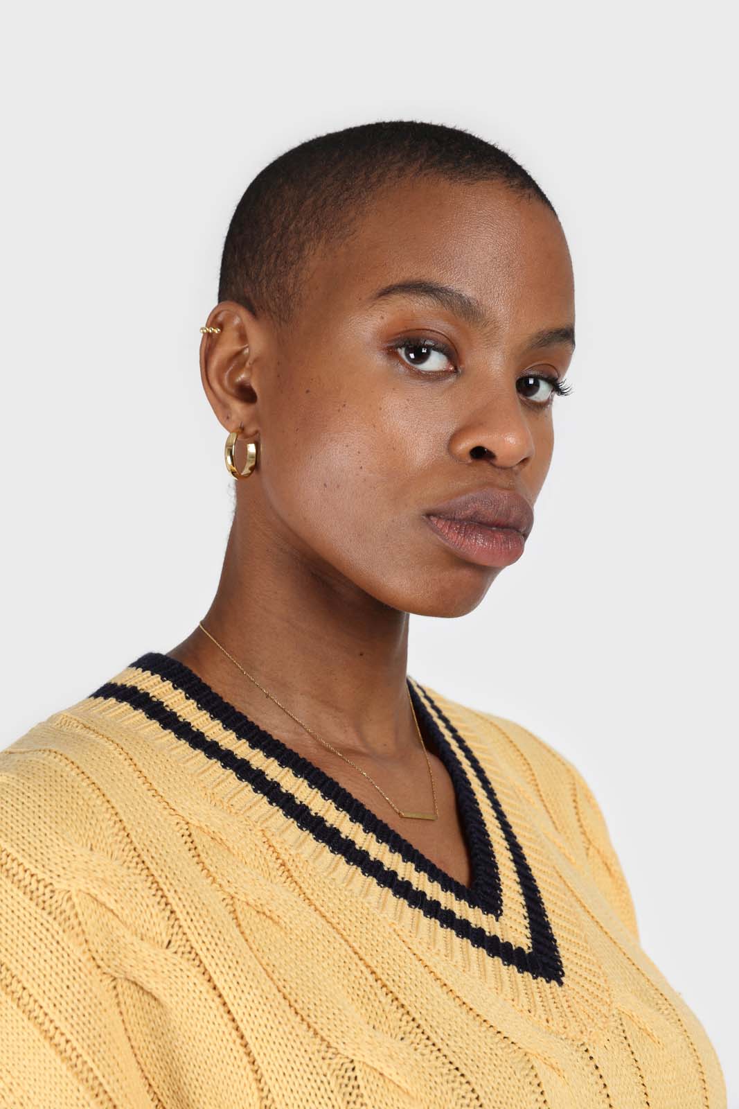 Yellow and black varsity trim cableknit vest