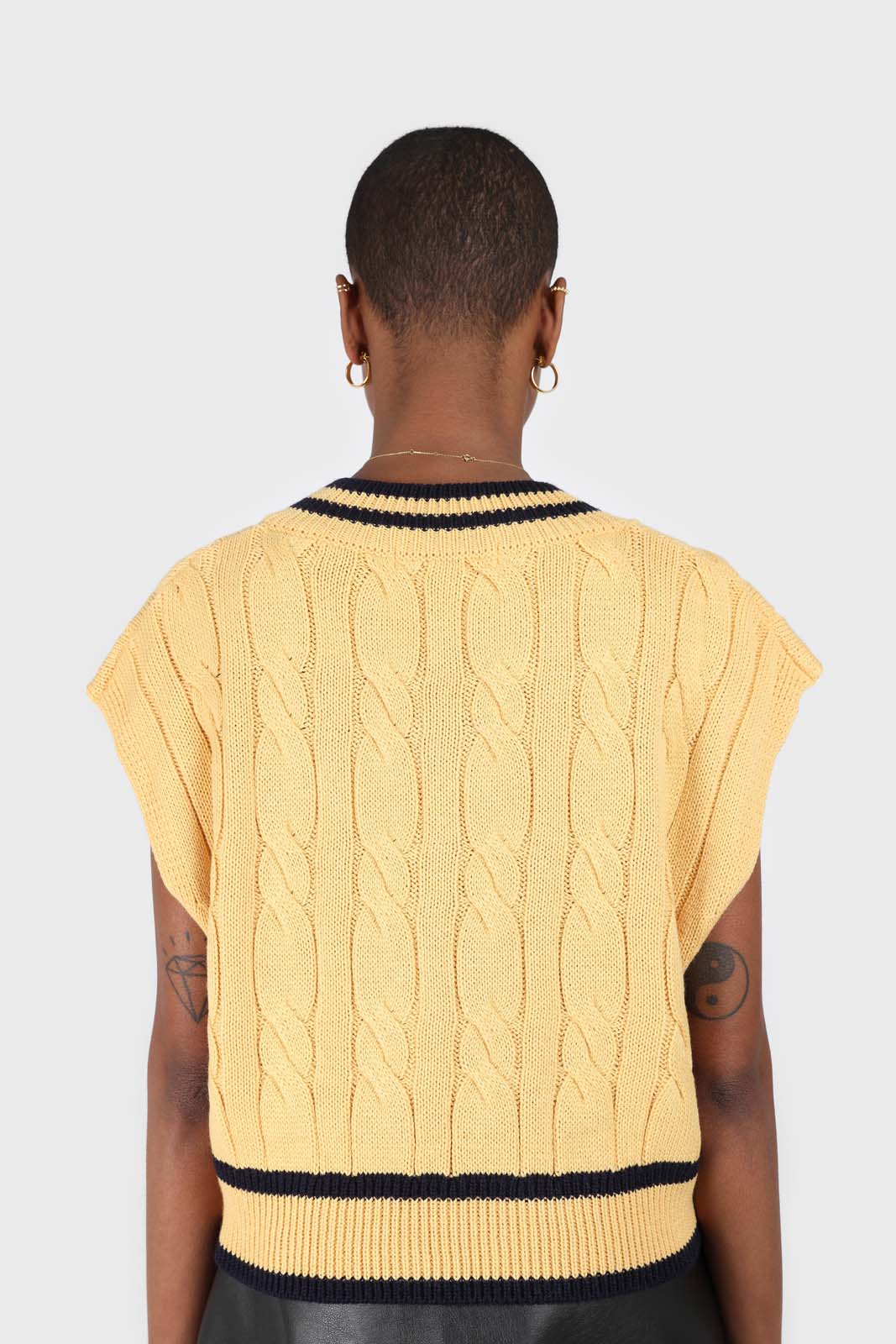 Yellow and black varsity trim cableknit vest